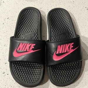Nike slides with pink writing